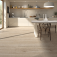 Kalon Haya wood-look porcelain tile in a cream kitchen with dark wood chairs and natural sunlight.