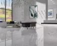 Camouflage Blanco Pulido Porcelain Tile — a luxurious white marble-look porcelain with a brilliant polished finish that enhances brightness and elegance. Its glossy surface brings sophistication and depth while offering durability, water resistance, and easy maintenance. Ideal for creating refined floors and walls in kitchens, bathrooms, and modern living spaces.