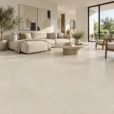 Bellevue Ivory Matte Porcelain Tile 32x32 – Modern living room featuring large-format beige porcelain floor tiles with subtle white veining, a matte finish, and elegant neutral decor.