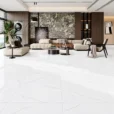 Calacatta Queen Marble Look Porcelain Tile 32x32 – Four square white porcelain tiles featuring elegant grey veining and subtle gold accents, displayed in a 2x2 grid on a clean white background.