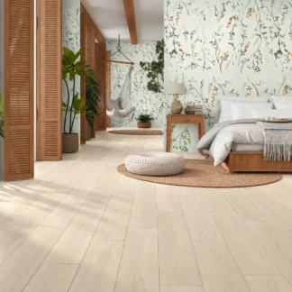 Argentario Betulla 8x48 Wood Look Porcelain Tile featuring light beige wood-look flooring in a modern bedroom with natural decor and soft lighting.