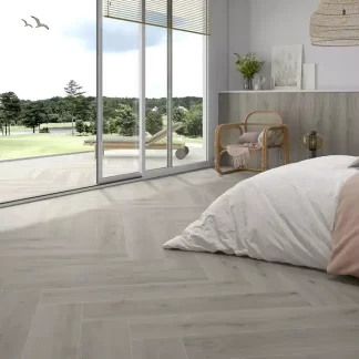 Versat Ash 9x48 Porcelain Tile — elegant wood-look porcelain in soft ash grey tones with authentic grain patterns. The 9x48 long plank format enhances the natural wood appearance while offering durability, water resistance, and easy maintenance. Perfect for floors and walls in kitchens, bathrooms, and living spaces.