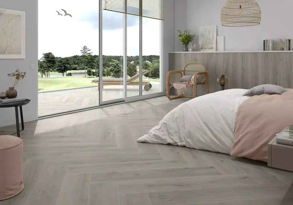 Versat Ash 9x48 Porcelain Tile β elegant wood-look porcelain in soft ash grey tones with authentic grain patterns. The 9x48 long plank format enhances the natural wood appearance while offering durability, water resistance, and easy maintenance. Perfect for floors and walls in kitchens, bathrooms, and living spaces.