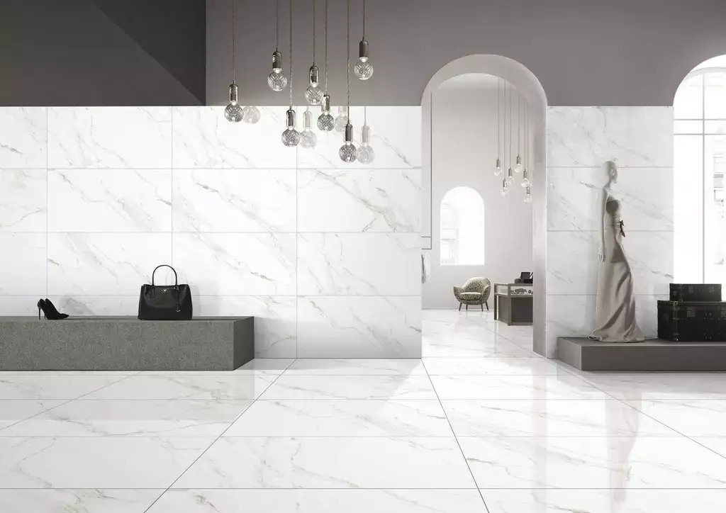 Naos Alpine Pulido Porcelain Tile β a sophisticated marble-look porcelain inspired by alpine stone, featuring bright white tones and delicate veining with a polished glossy finish. Its luxurious design enhances brightness and elegance while ensuring durability, water resistance, and easy maintenance. Perfect for stylish floors and walls in kitchens, bathrooms, and living areas.