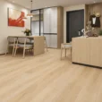 Praline SPC vinyl flooring with a honey oak wood look installed in a modern Japandi living space by The Flooring District in Tampa, Florida.