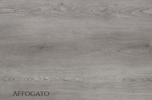 Affogato SPC vinyl flooring with a smoky grey wood look installed in a modern industrial living room by The Flooring District
