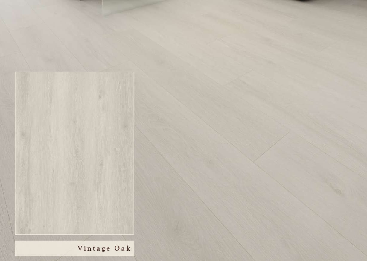 Vintage Oak SPC vinyl flooring with a sun-bleached weathered wood look installed in a luxury coastal living room by The Flooring District in Tampa, Florida.