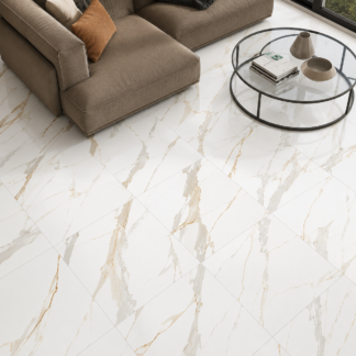 Carrara Polaris Gold 24x24 porcelain tile with a polished white and gold marble look installed in a luxury living room by The Flooring District in Tampa, Florida.