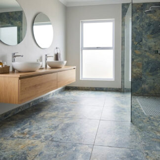 Osso 13x26 antislip porcelain tile showcasing a high-variance blue slate stone look with earthy rust veins for an outdoor patio design by The Flooring District in Tampa, Florida